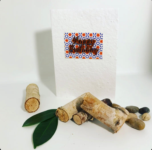 Seeded, plantable greeting card. With hand painted orange 'birthday' motif on embossed background.