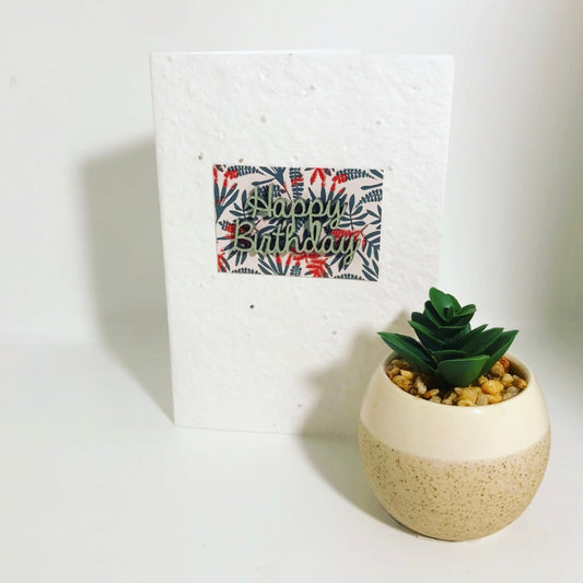 Seeded, plantable greeting card. With hand painted in pale green 'birthday' motif on embossed background.