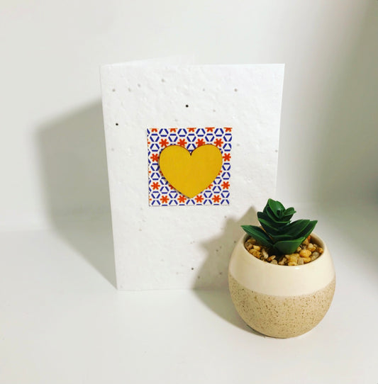 Seeded, plantable greeting card, with yellow, hand painted 'heart' motif with embossed background
