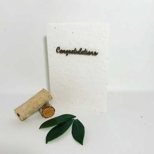 Seeded, plantable greeting card. With hand painted gold 'congratulations' motif .