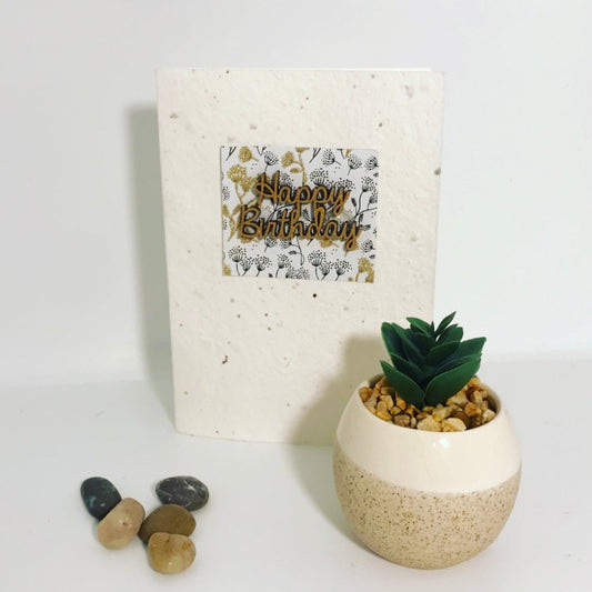 Seeded, plantable greeting card. With hand painted gold 'birthday' motif on embossed background.